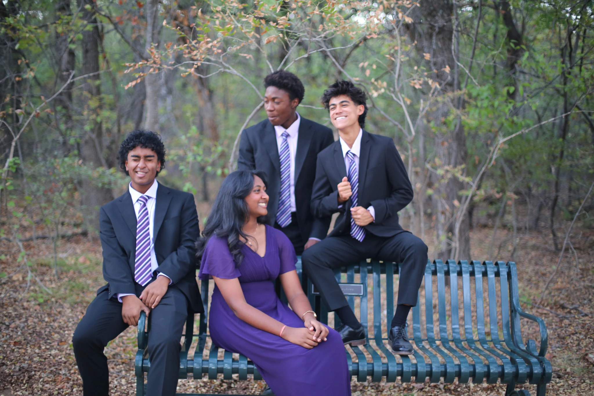 Orion Quartet sharing a relaxed moment around a park bench